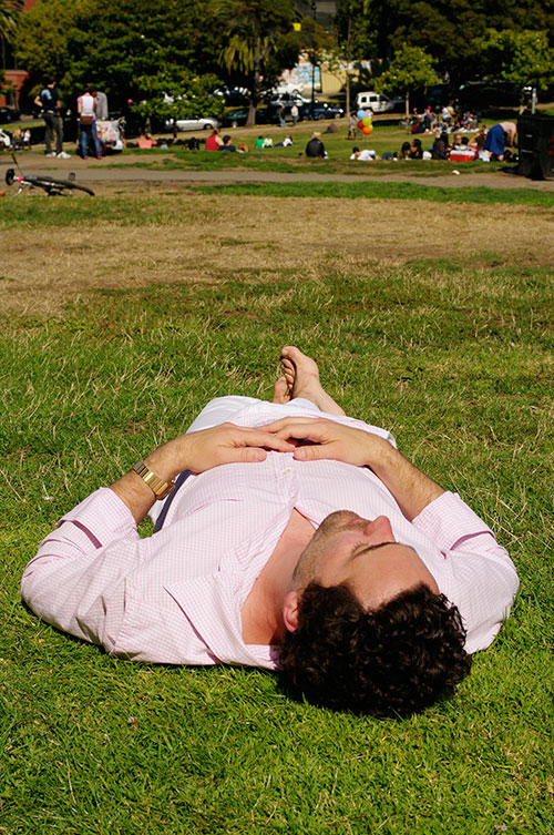 man lying down in grass